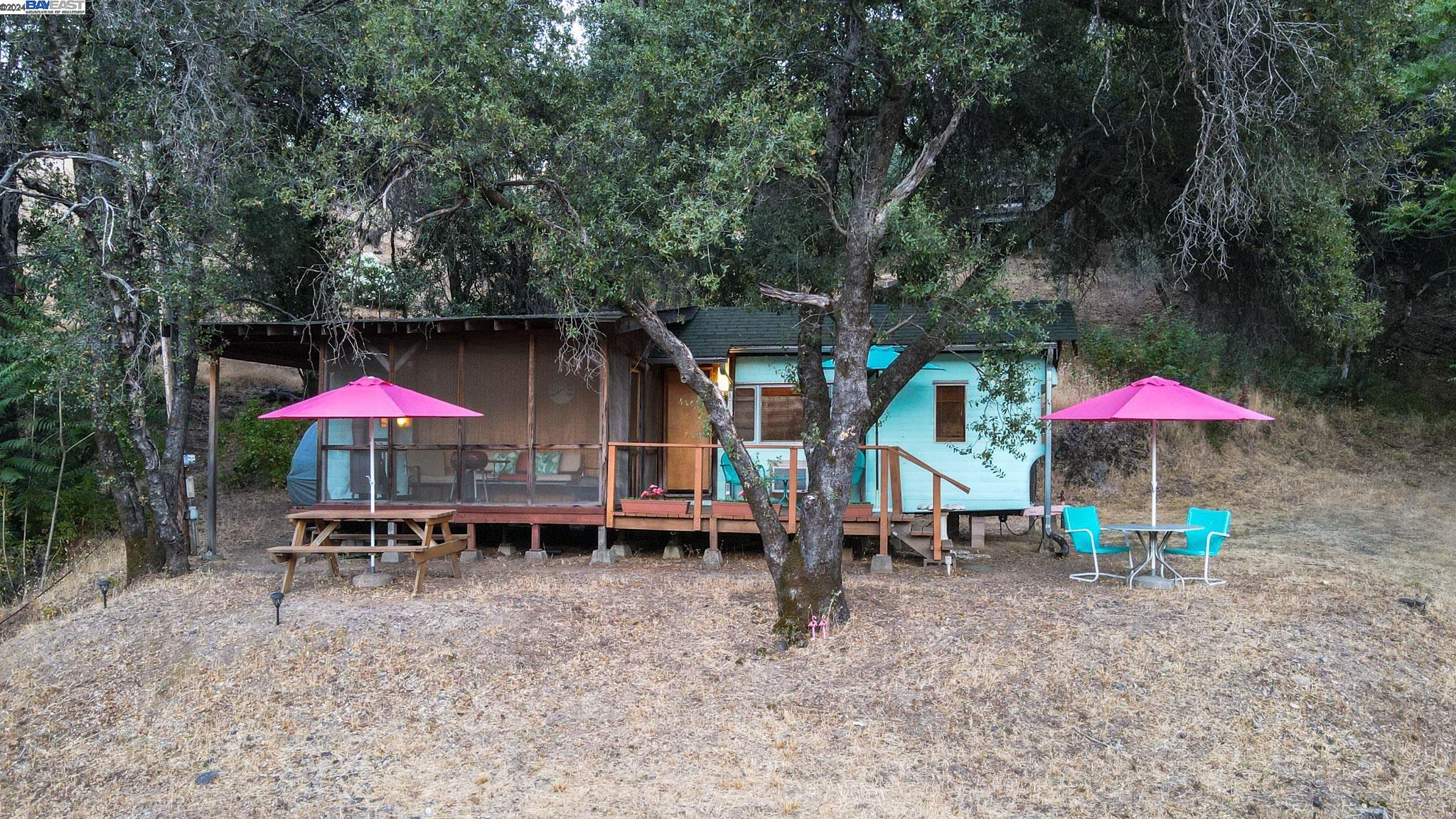 an outdoor space with patio and white umbrellas