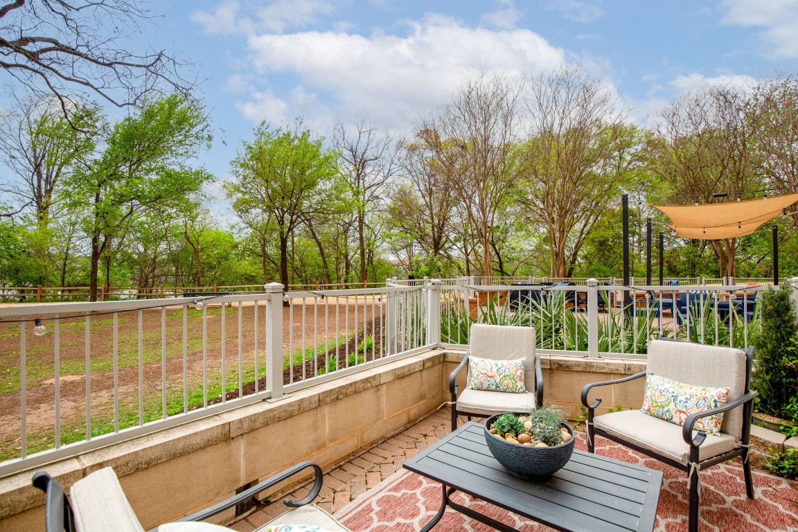 a view of a chairs and table on the deck