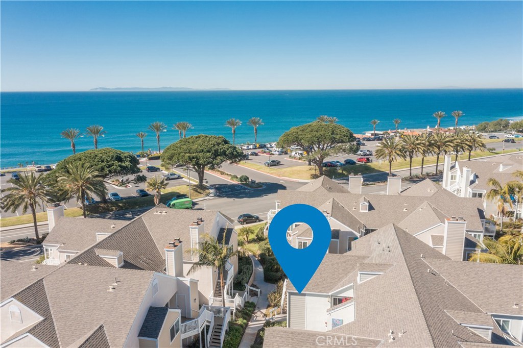 an aerial view of a house with a ocean view