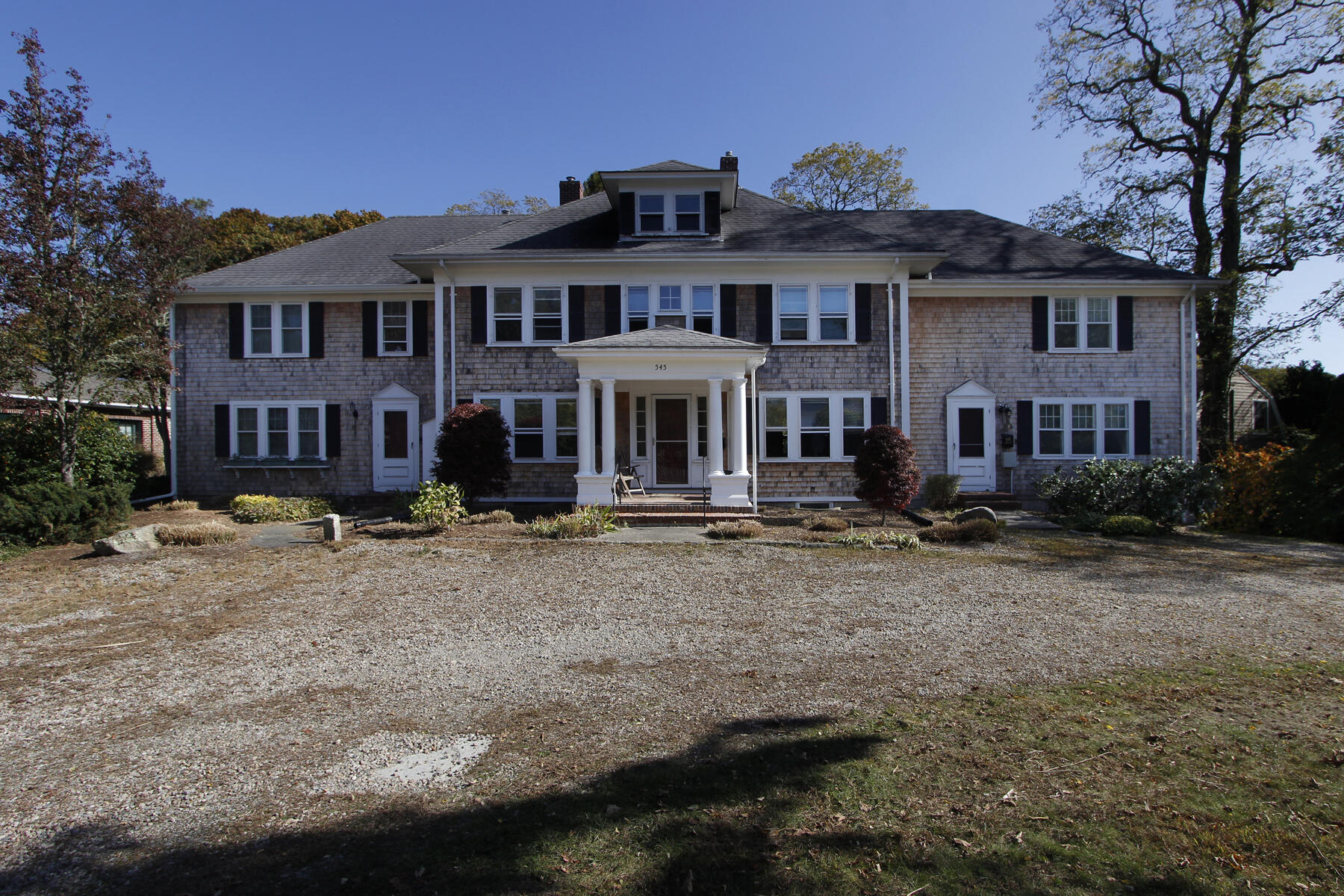 front view of a house with a yard