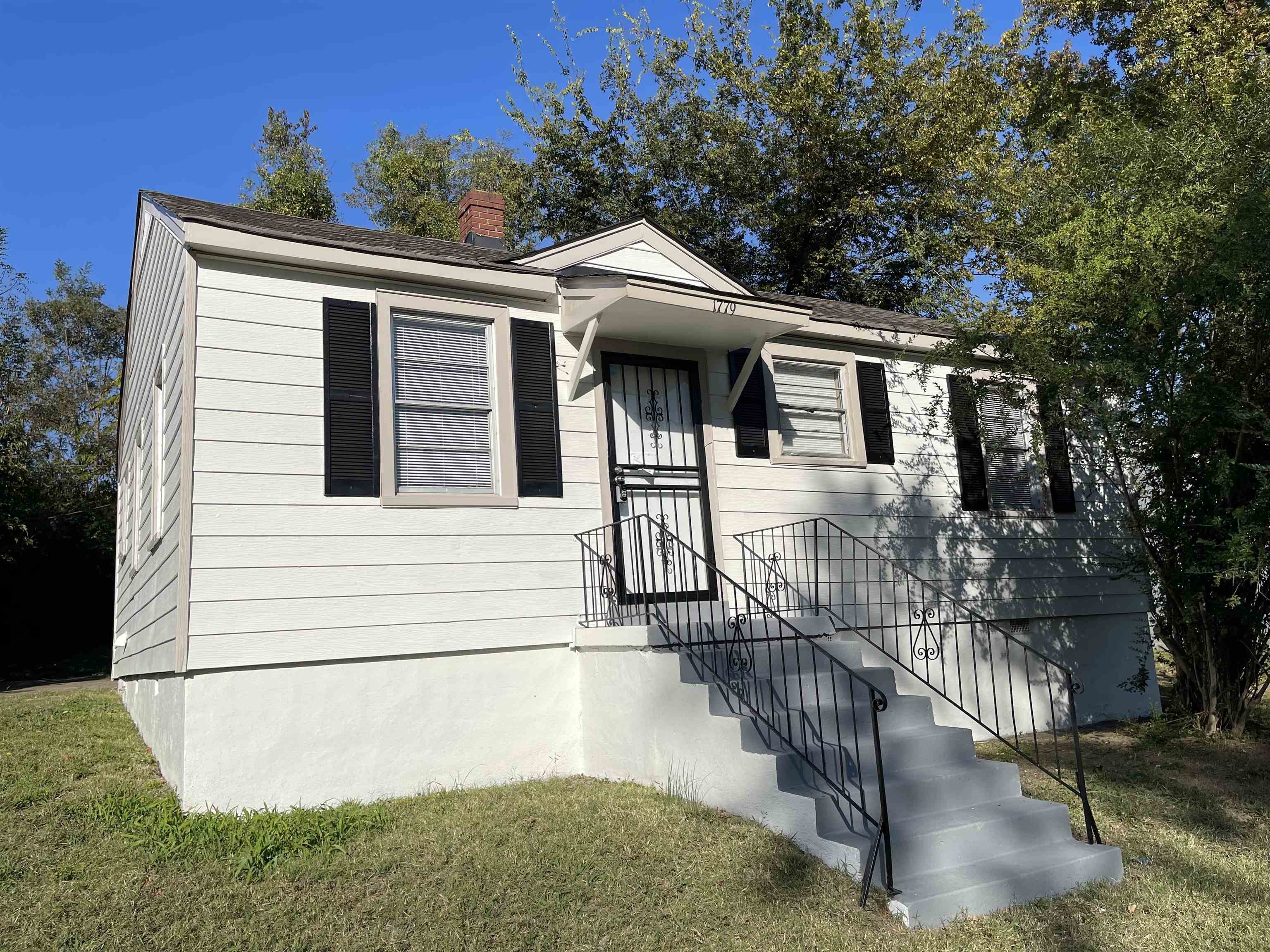 a front view of a house with yard