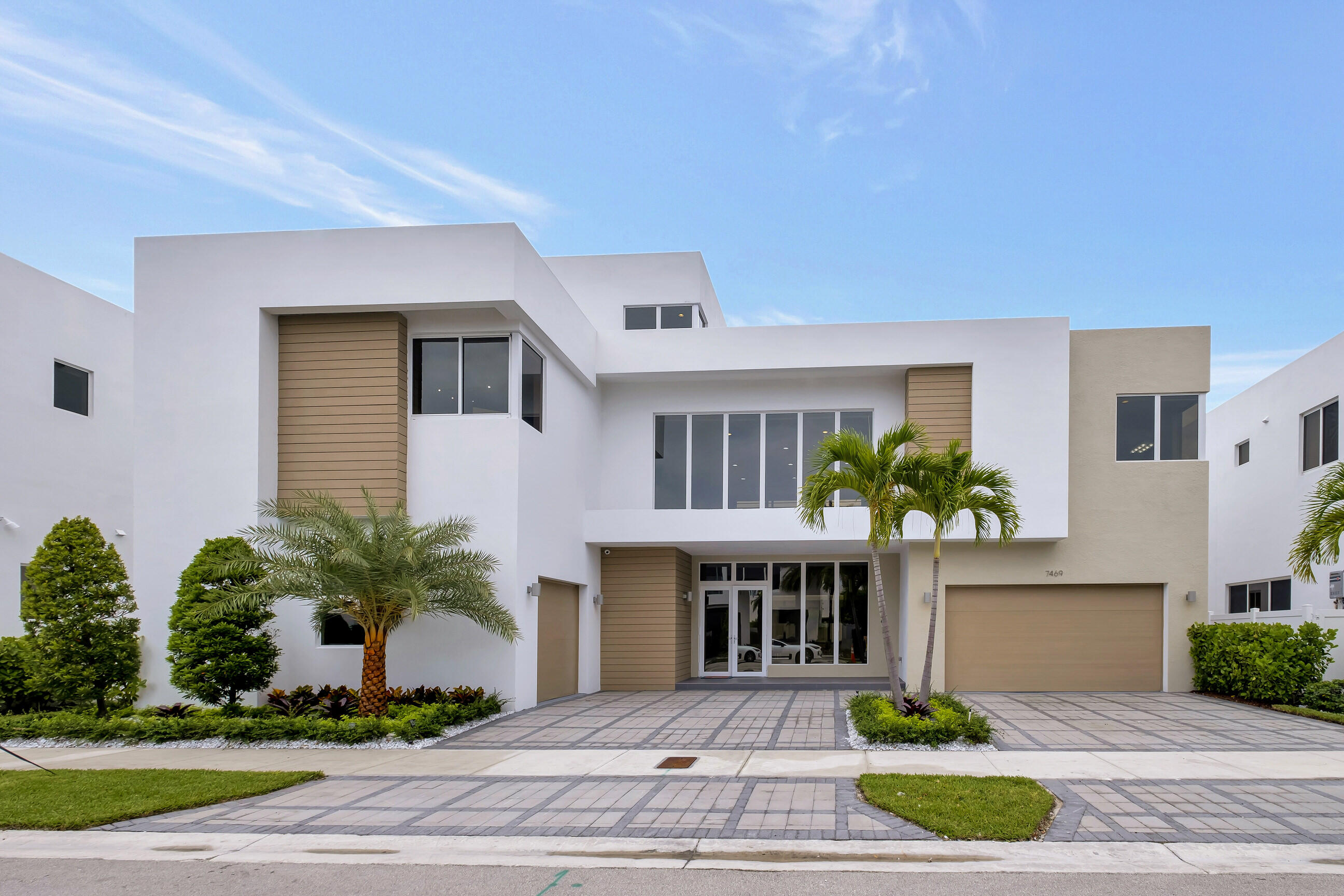 a front view of house and yard with green space