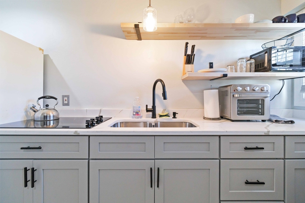 a kitchen with a sink and cabinets