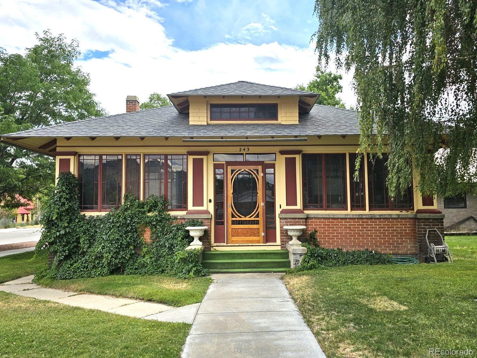 front view of a house with a yard