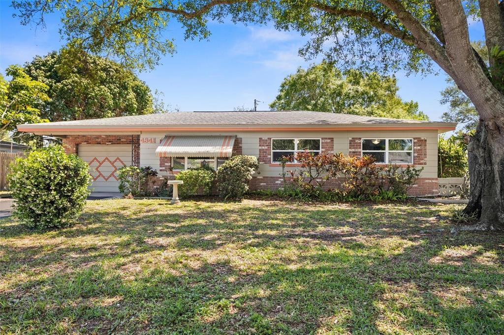 front view of a house with a yard