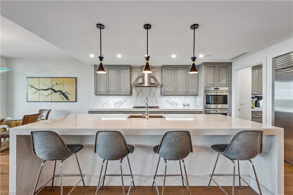 Kitchen with pendant lighting, a breakfast bar