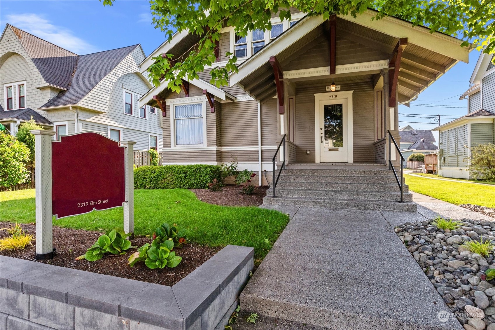 a front view of a house with garden