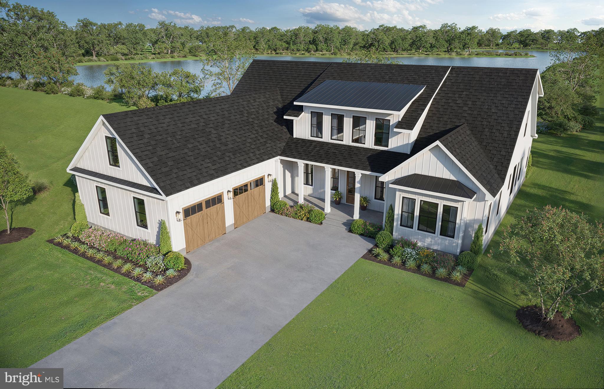 a aerial view of a house with a yard