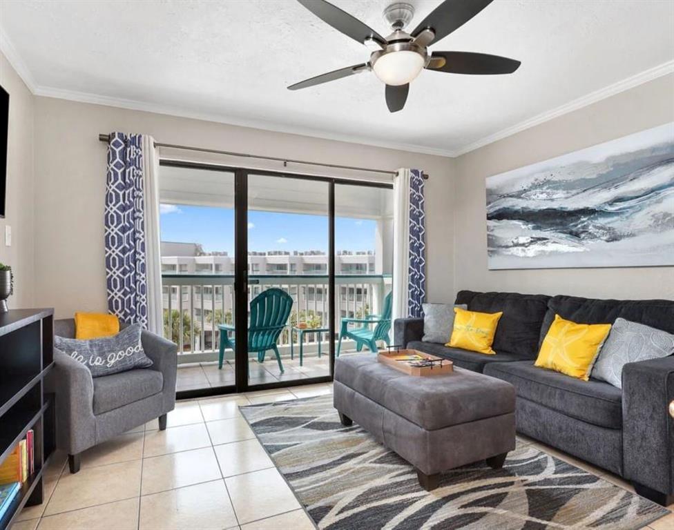 Welcome to your piece of paradise on the island! This inviting living area features an open-concept design that flows seamlessly onto the patio, where you can soak in beautiful ocean views.