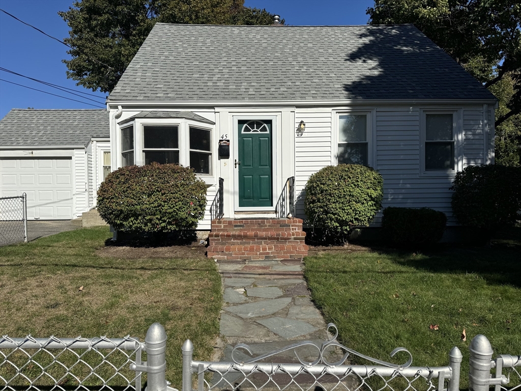 front view of a house with a garden