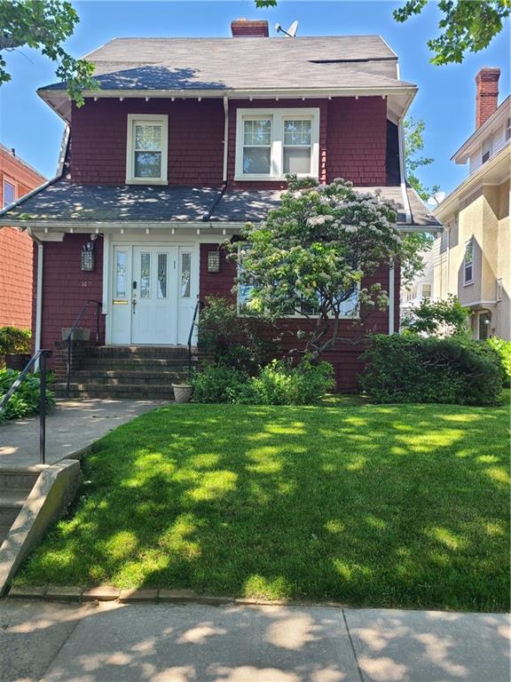 front view of a house with a garden