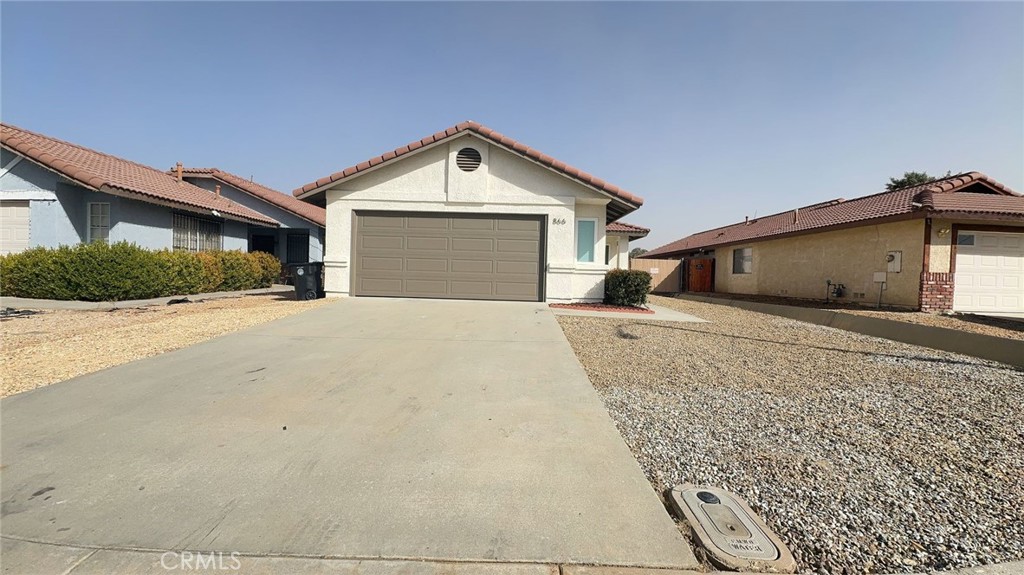 a view of garage and yard