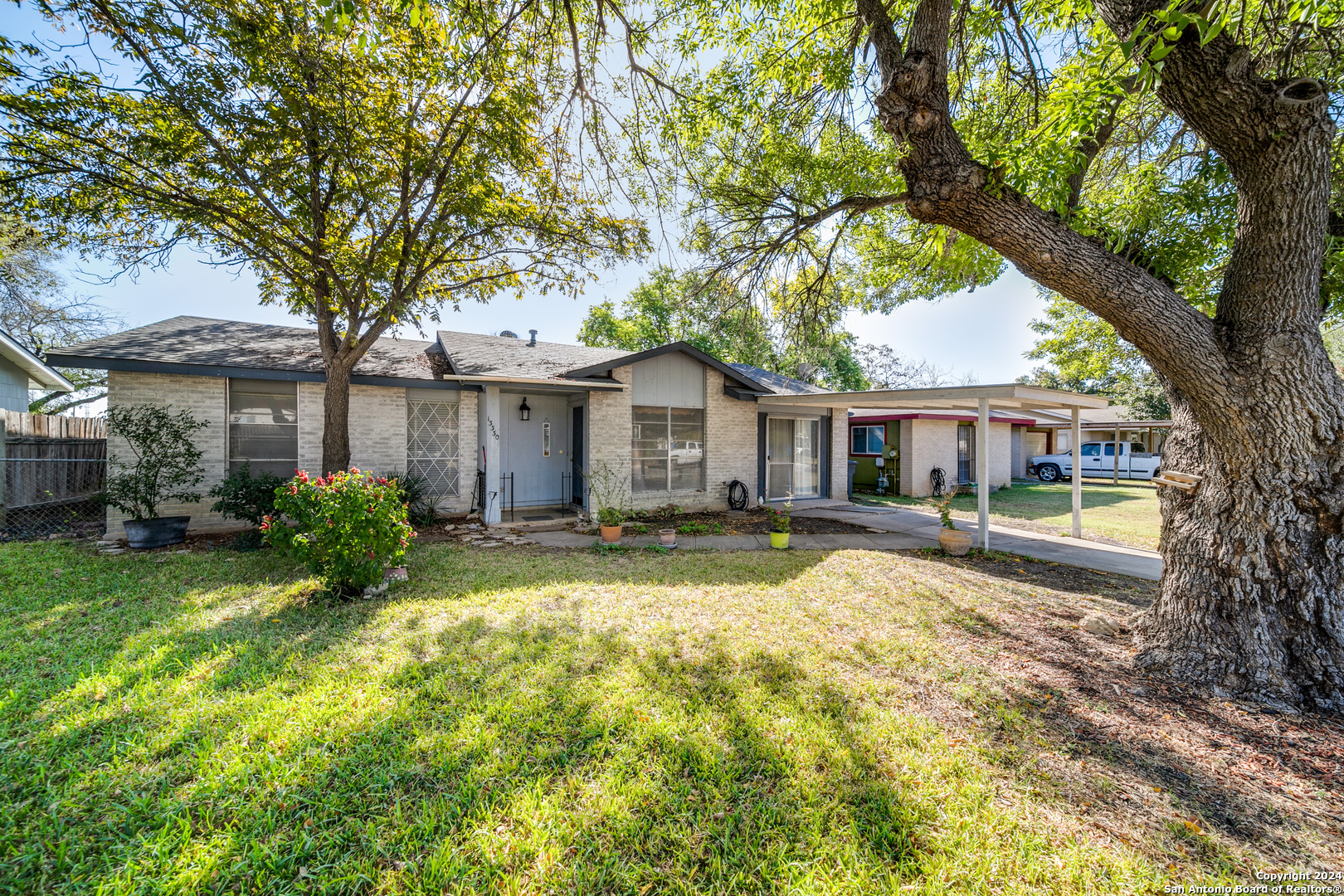 a front view of a house with a yard and porch