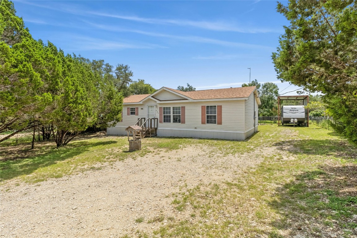 a house with trees in the background