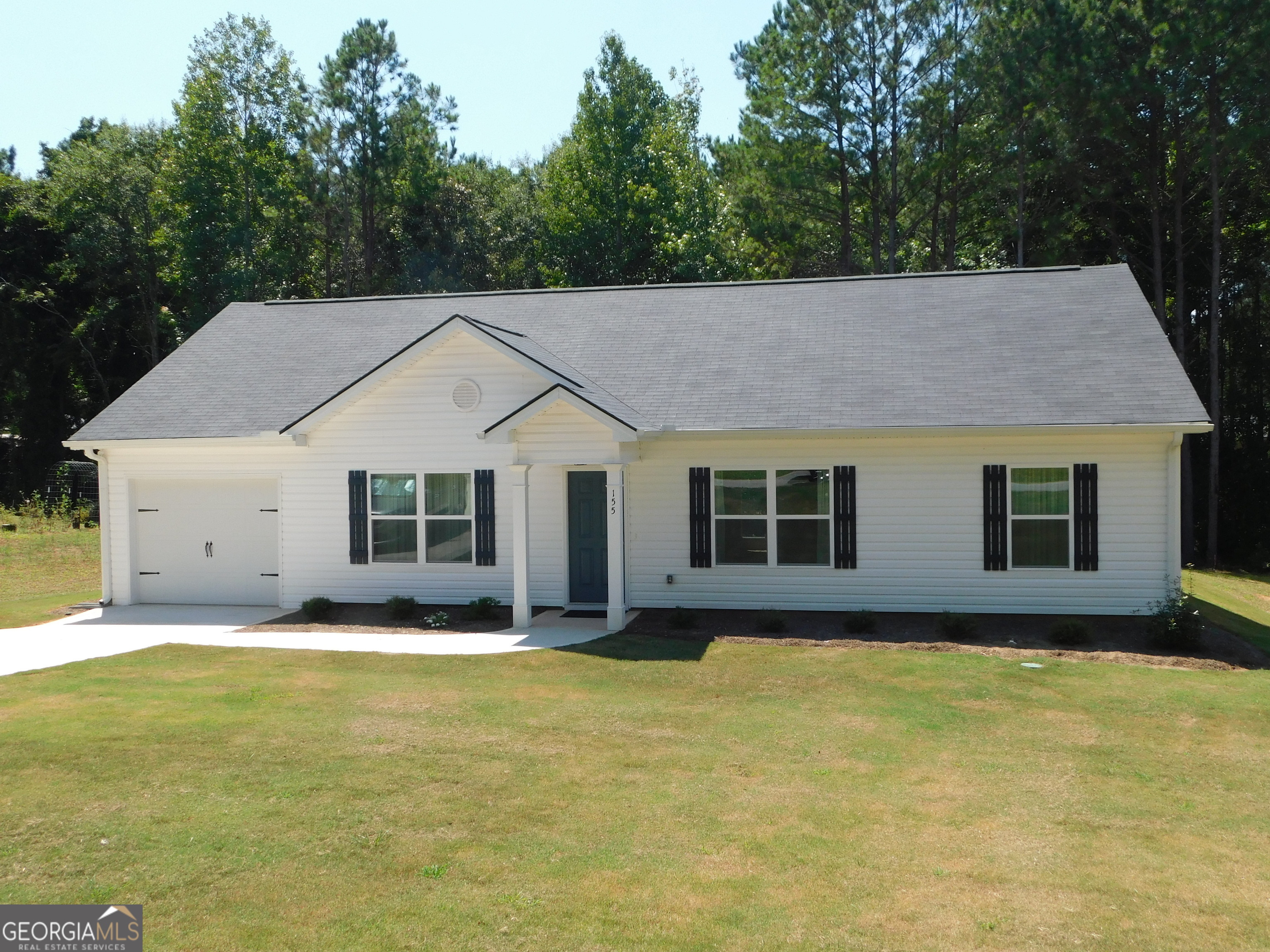 a view of a house with pool and yard