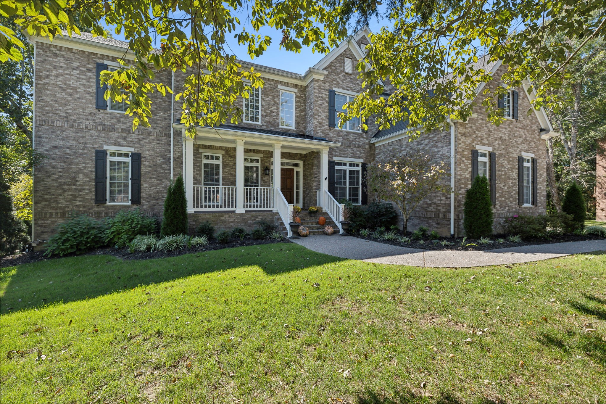 front view of a house with a yard