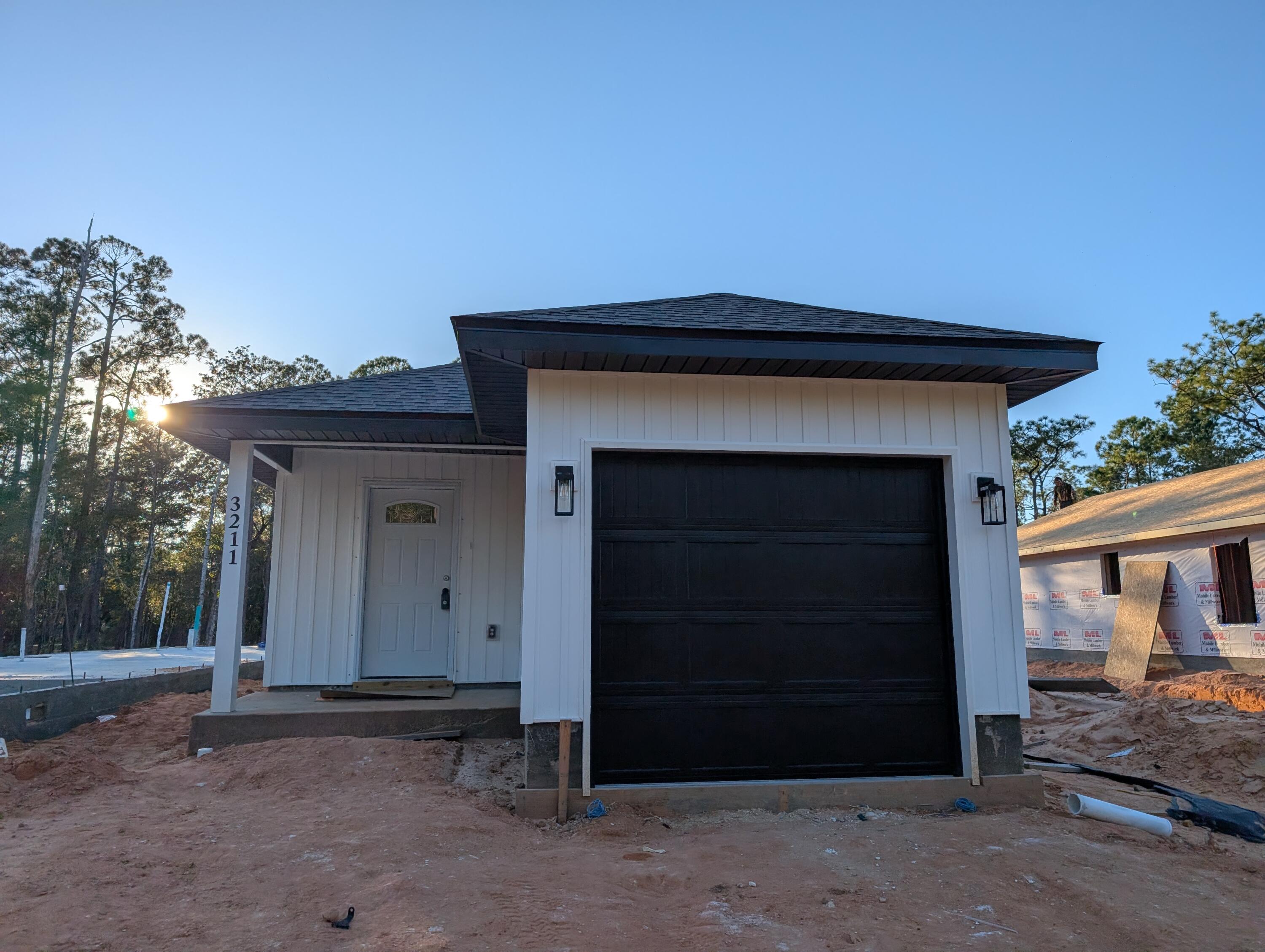 a front view of a house with a garage