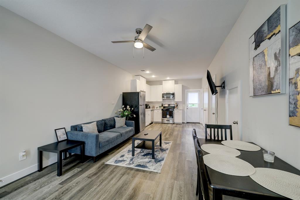 a living room with furniture and a table