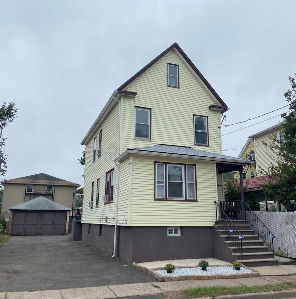 a front view of a house with garage