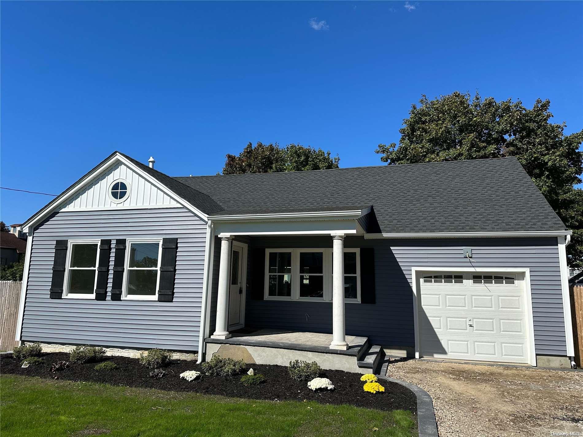 a front view of a house with yard