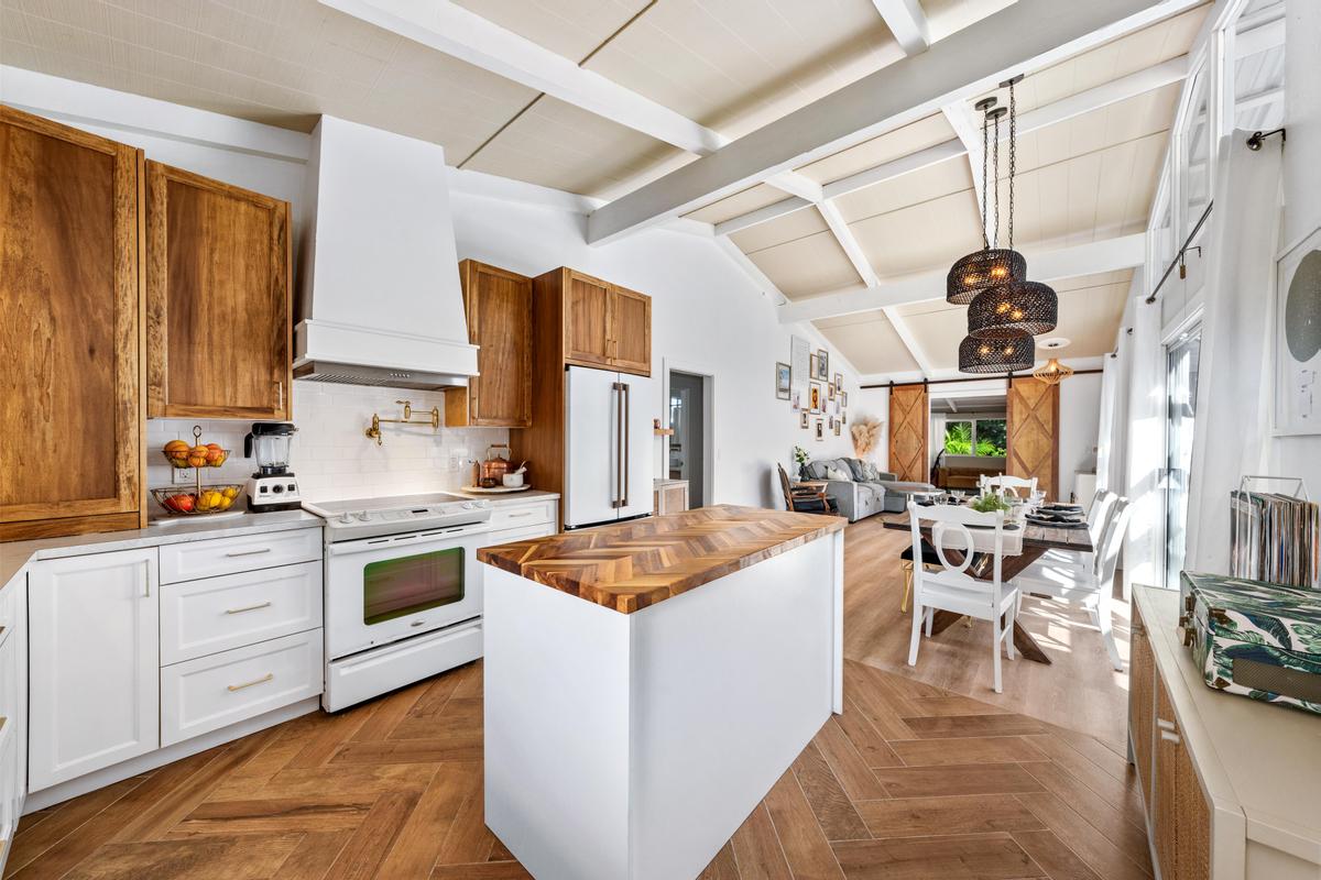 a kitchen that has a lot of cabinets in it