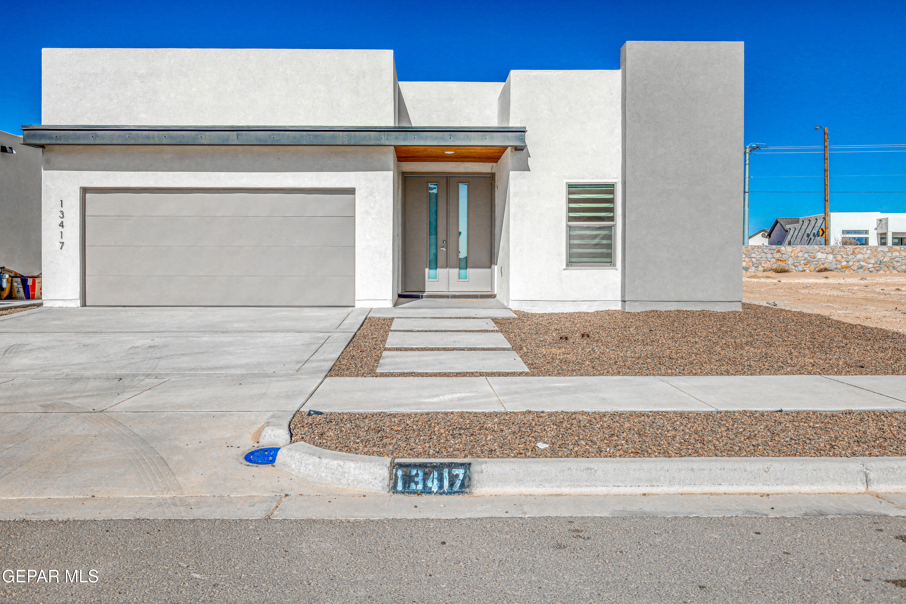 a front view of a house with a garage