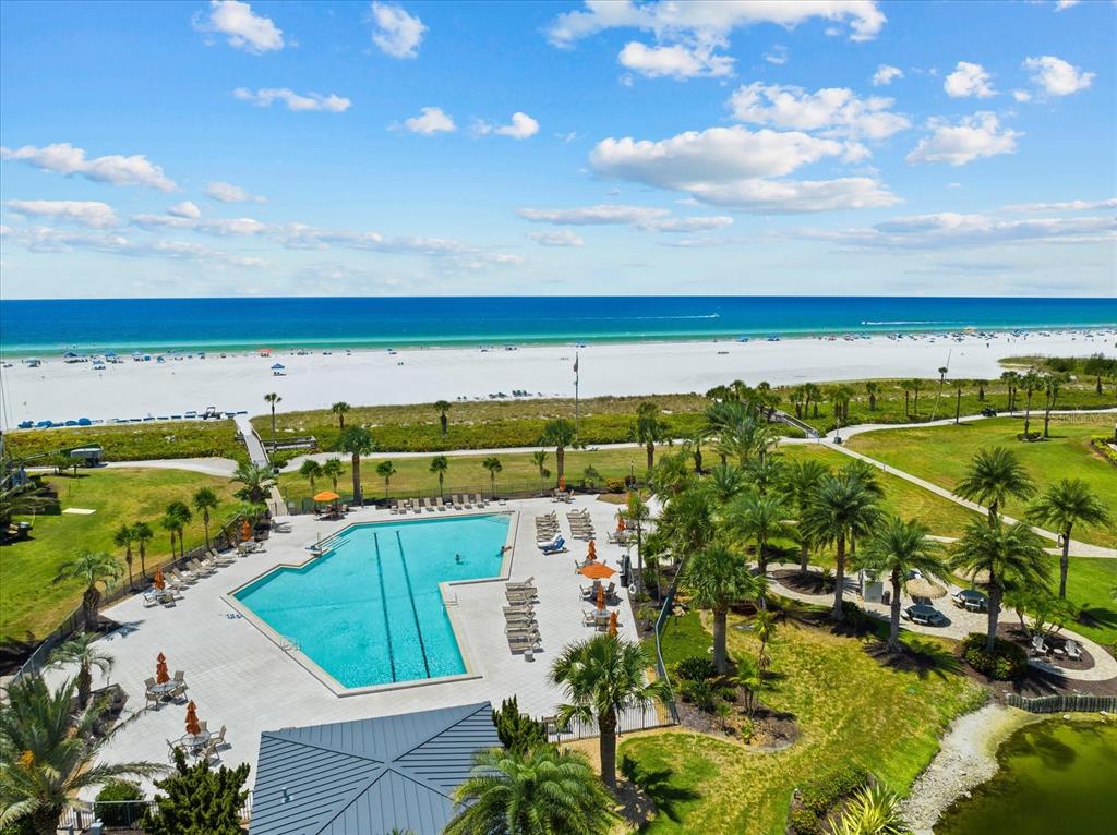 a view of a swimming pool and an outdoor seating