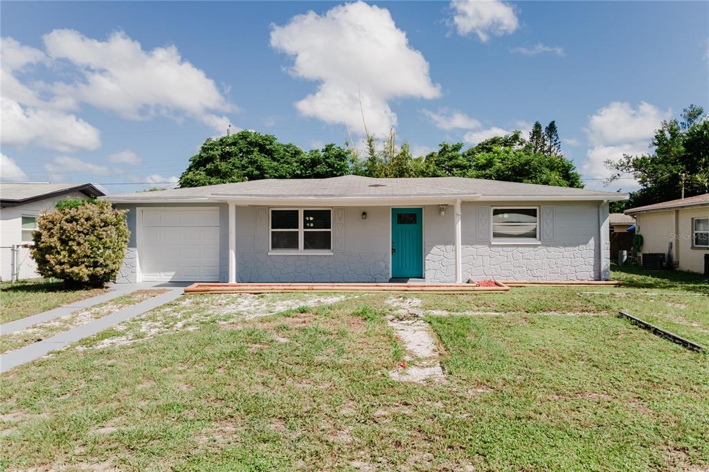 front view of a house with a yard