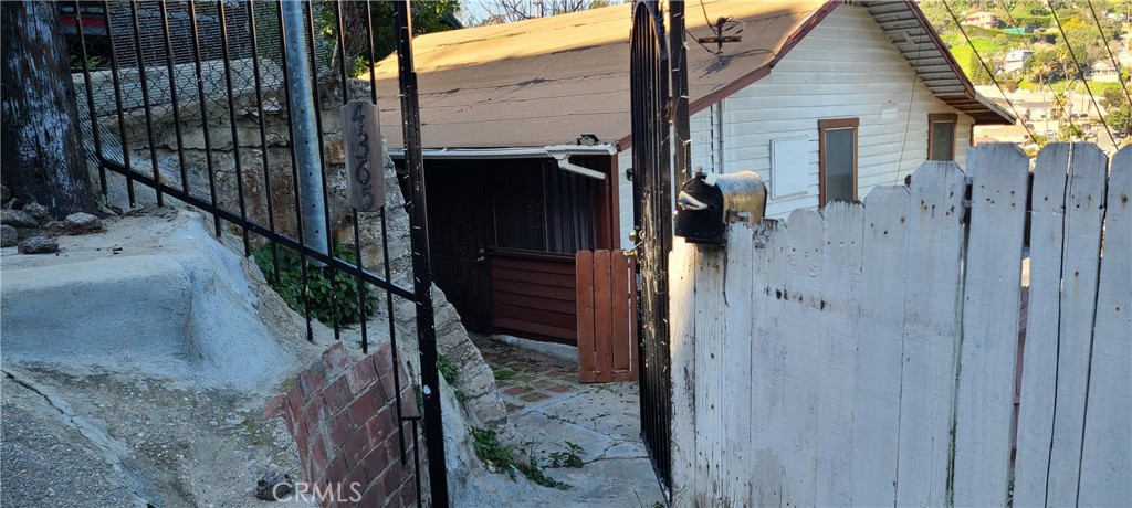 a view of a wooden door of the house