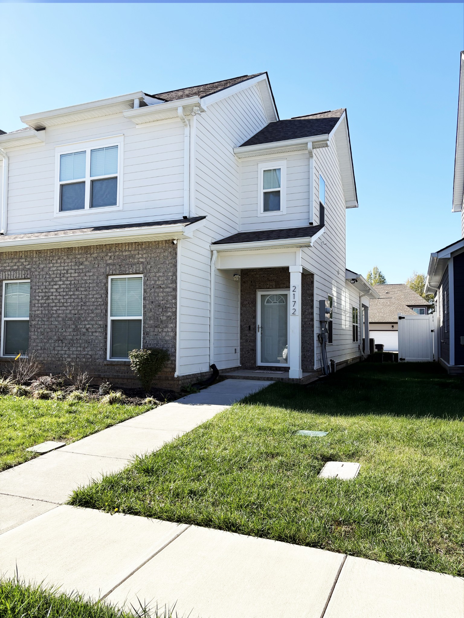 a view of a yard in front of a house