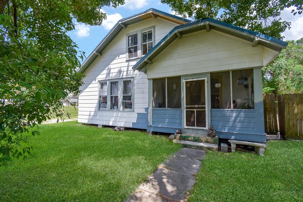 Front of the house with screened in porch to the right hand side.