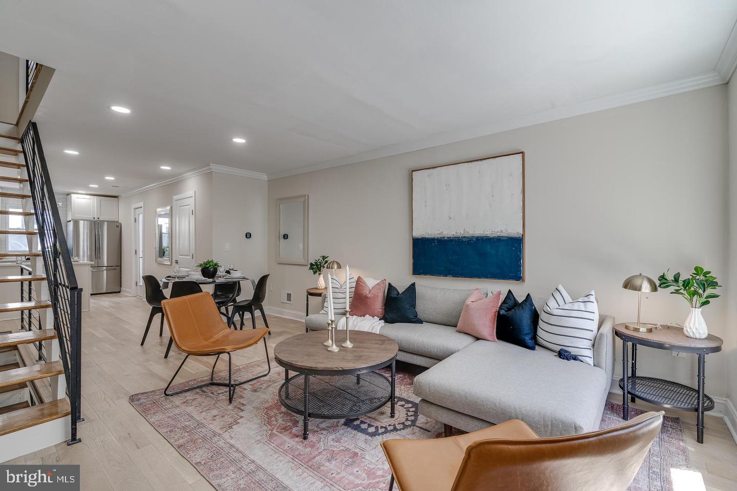 a living room with furniture and a rug