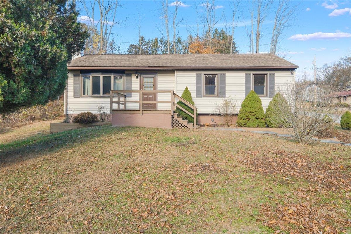 a front view of a house with yard