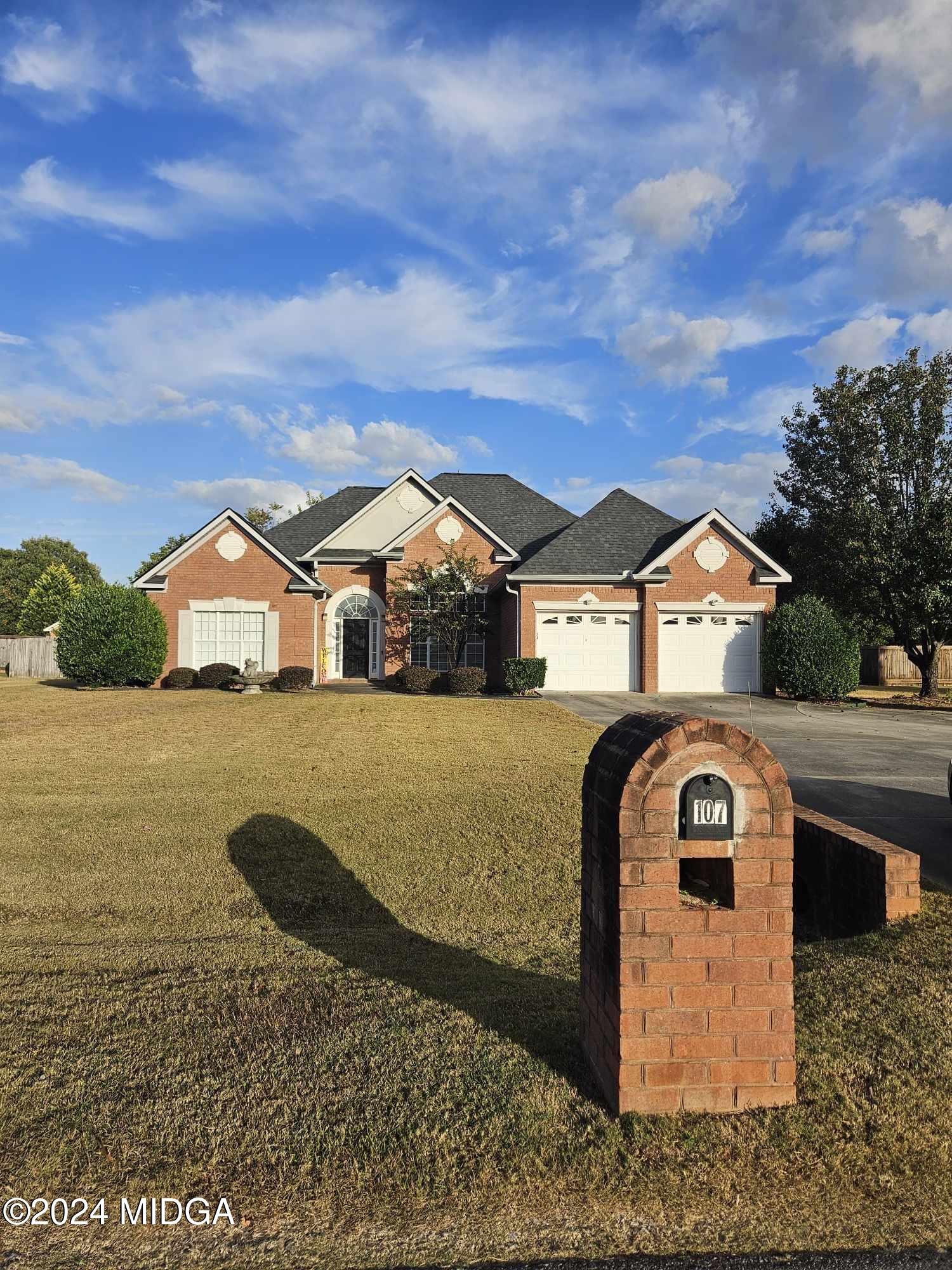 a front view of a house with a yard