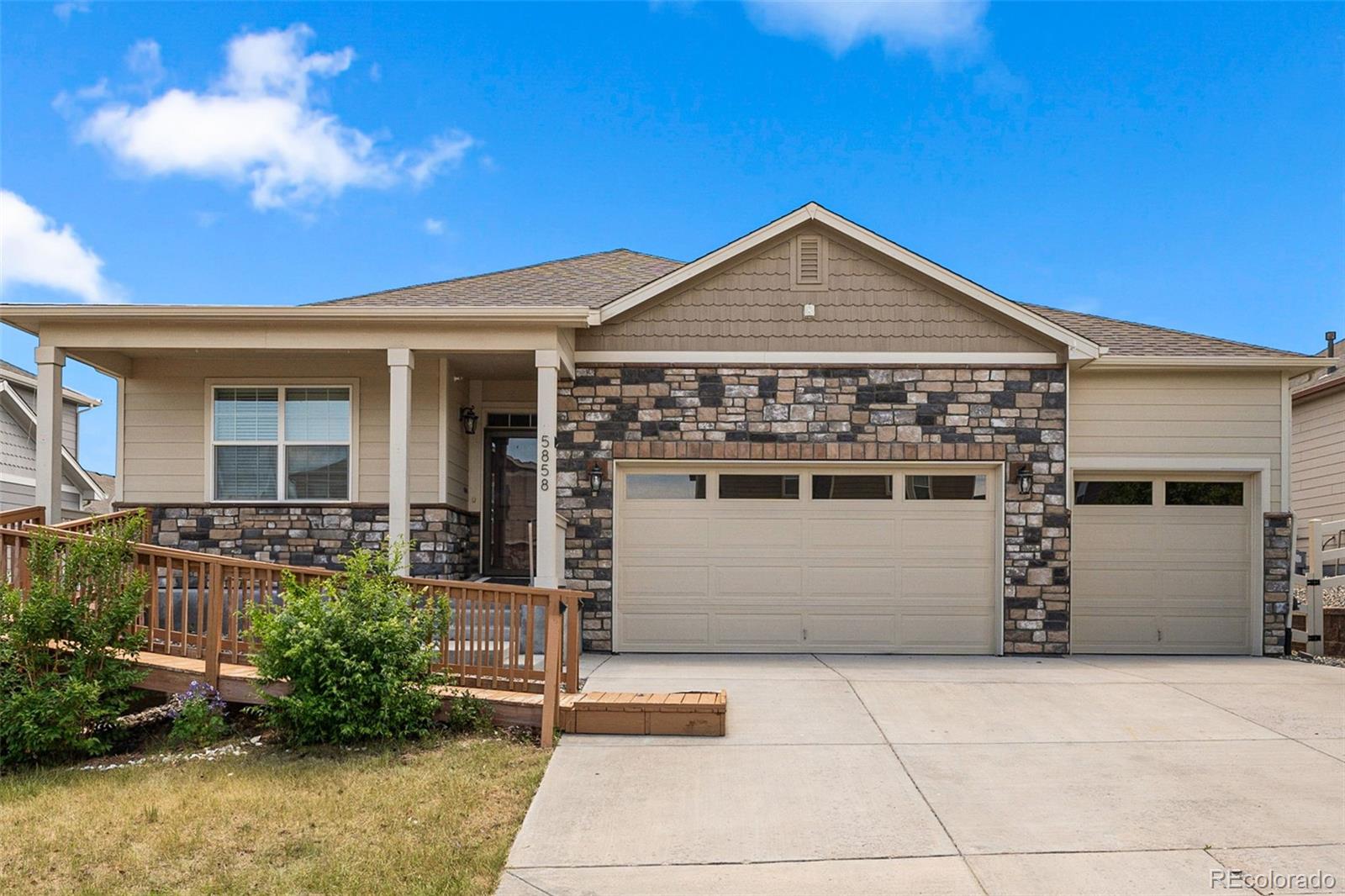 a front view of a house with a garage