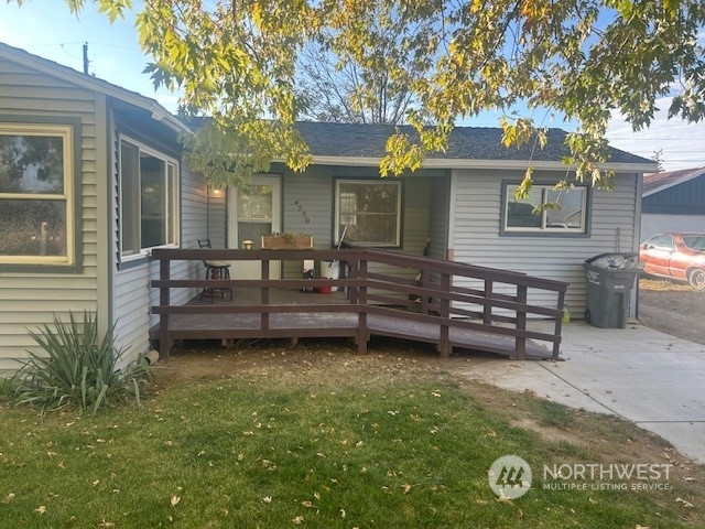 a view of a house with a chairs in a patio