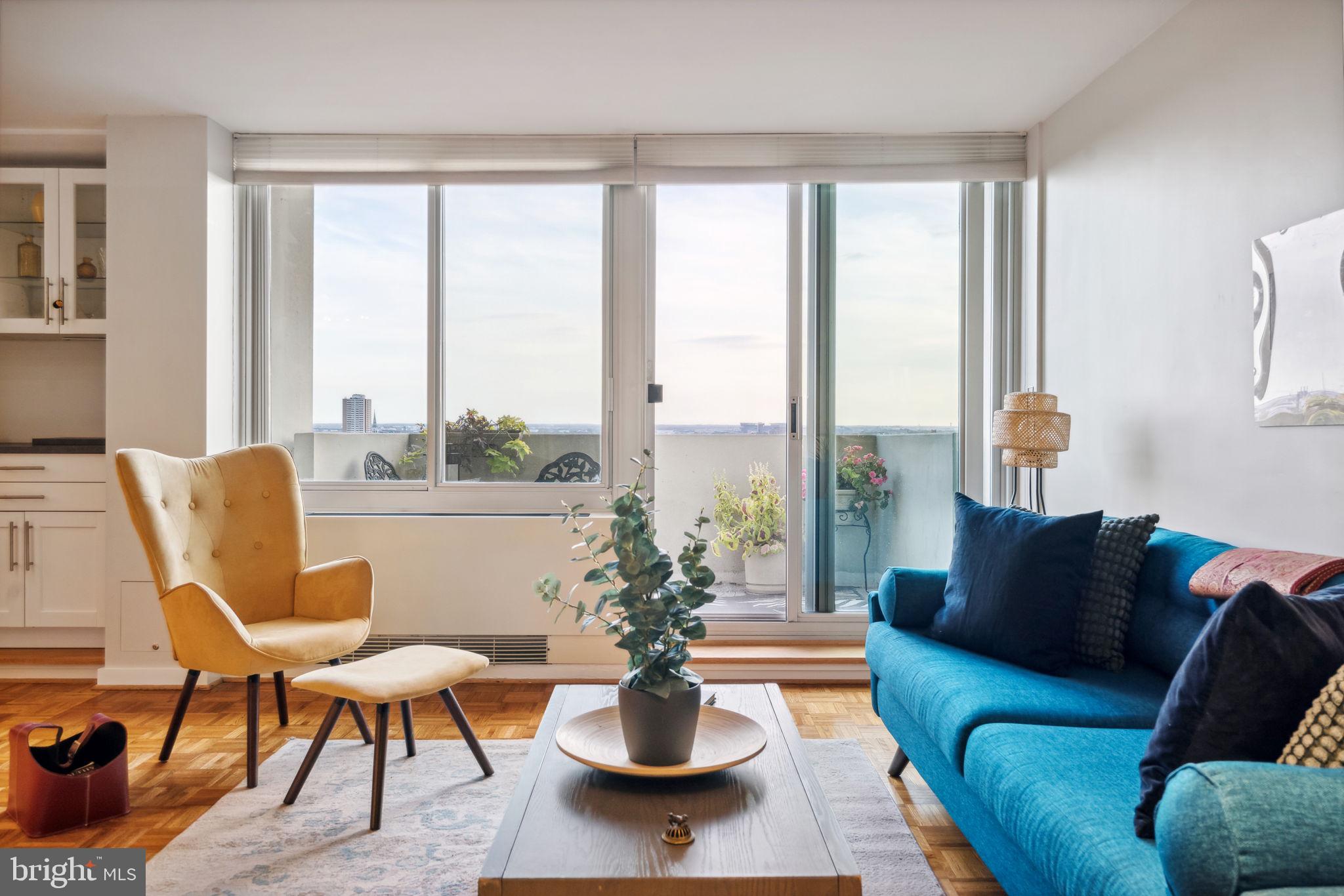 a living room with furniture and a large window