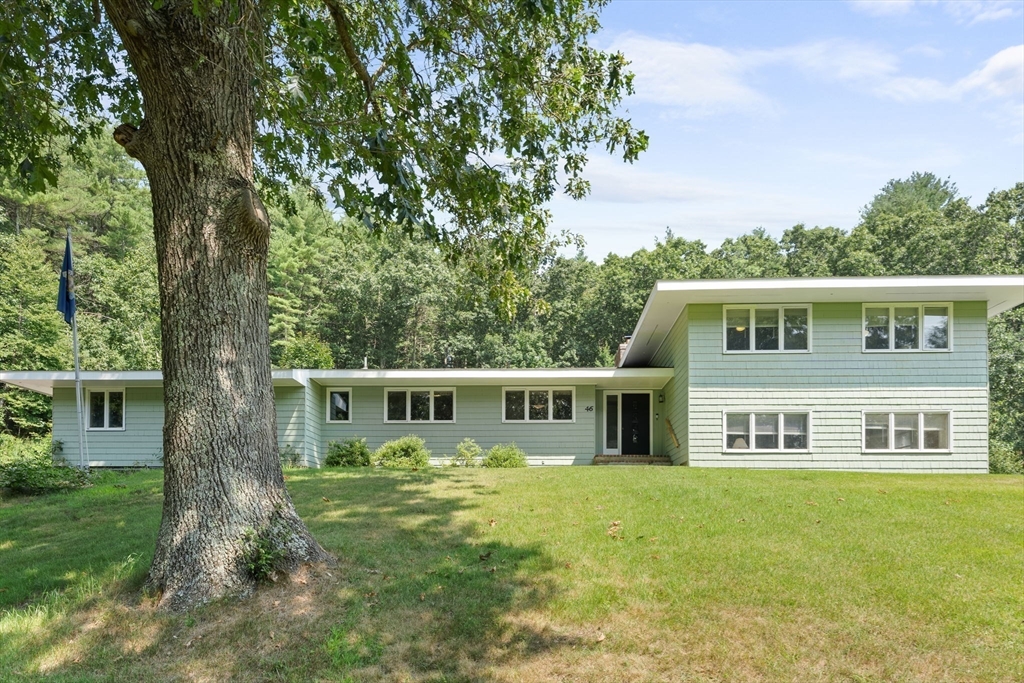 front view of a house with a yard