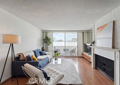 a living room with furniture fireplace and a flat screen tv