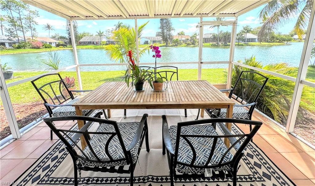 a view of balcony with table and chairs and wooden floor