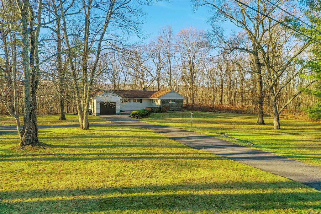 View of front of property with a front lawn