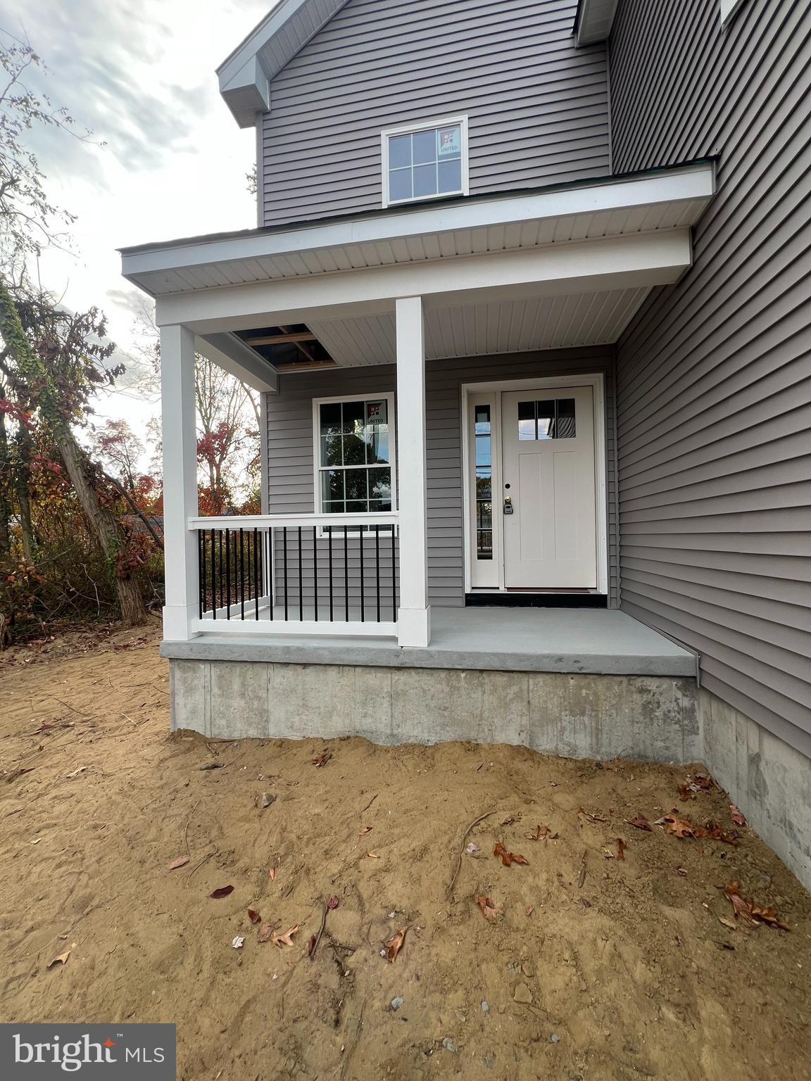 a view of a house with a wooden deck