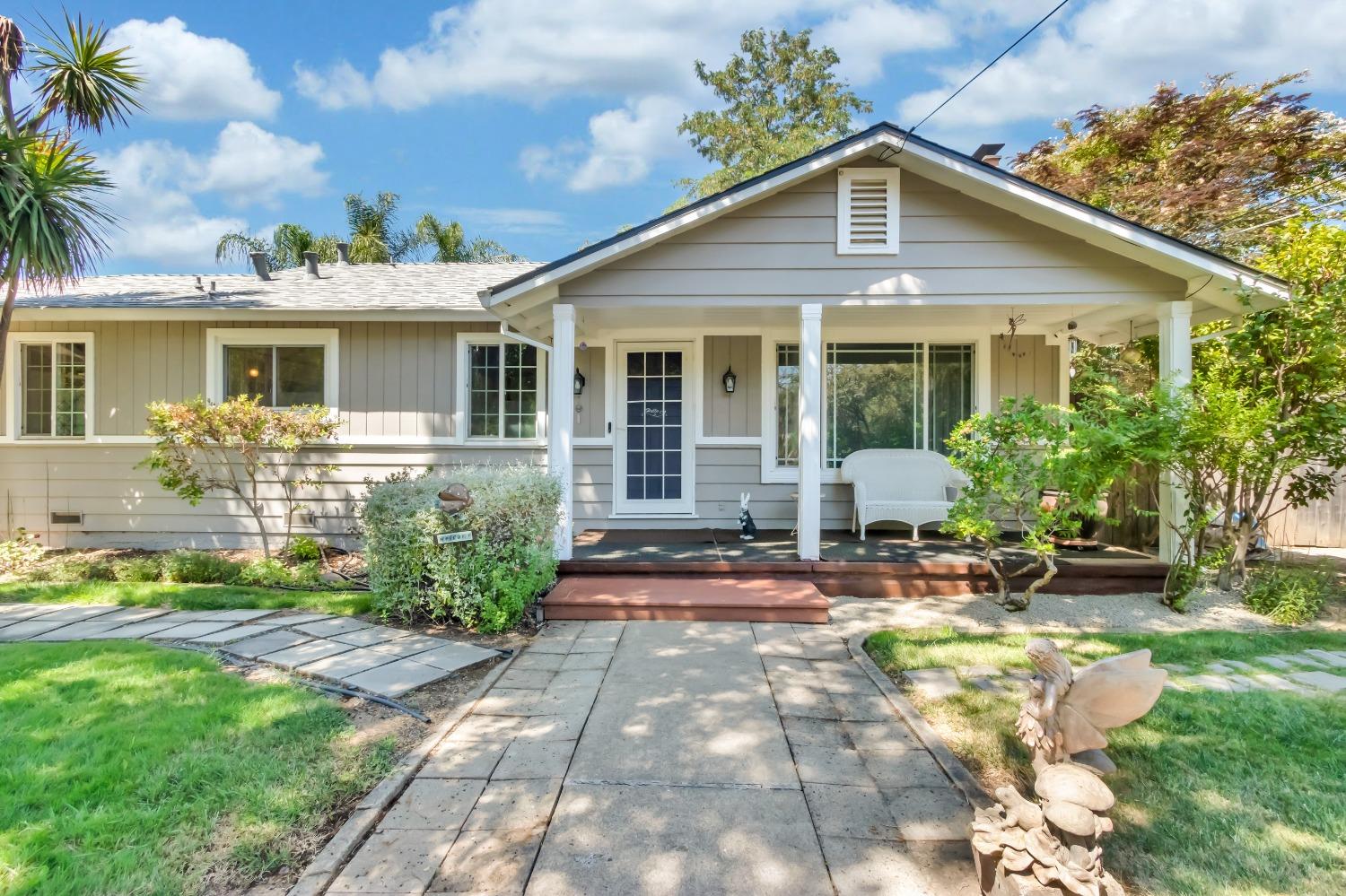 a front view of a house with garden