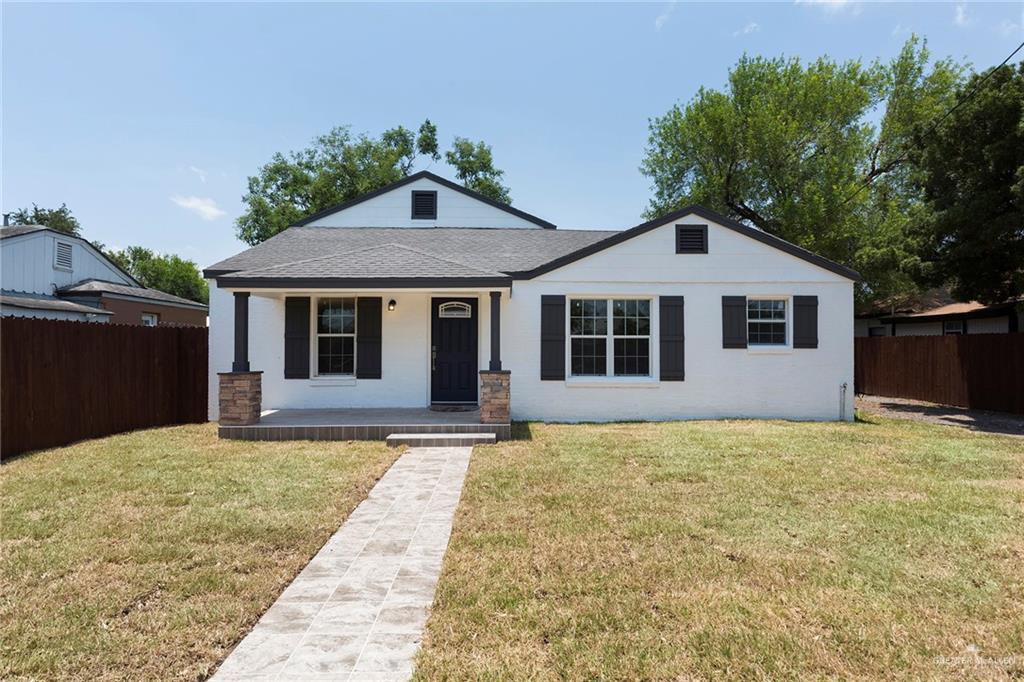 a front view of a house with yard