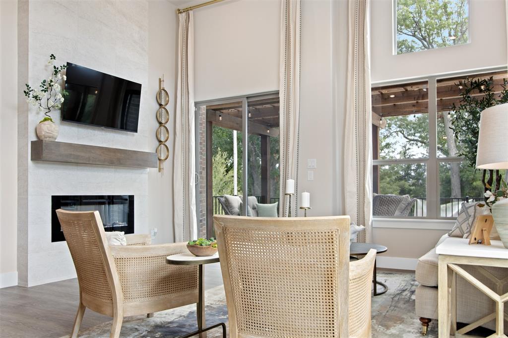 a living room with a fireplace and a flat screen tv