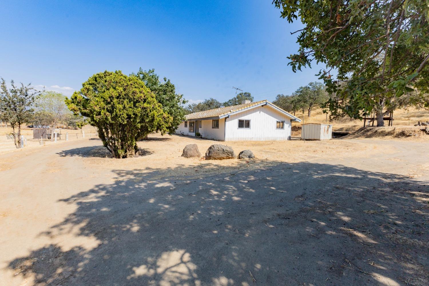 a house with trees in the background