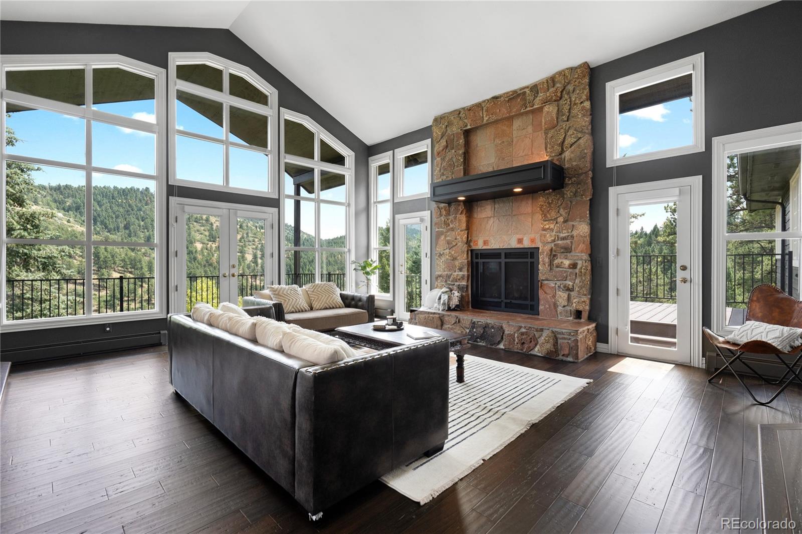 a living room with furniture fireplace and flat screen tv