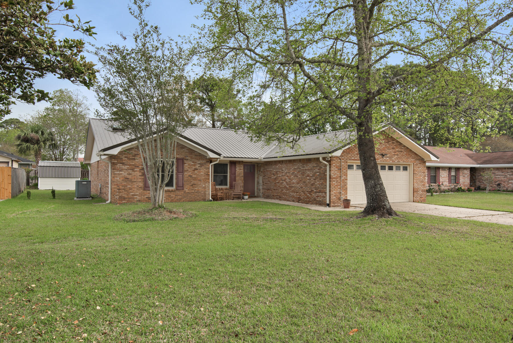 a house with a tree in front of the house