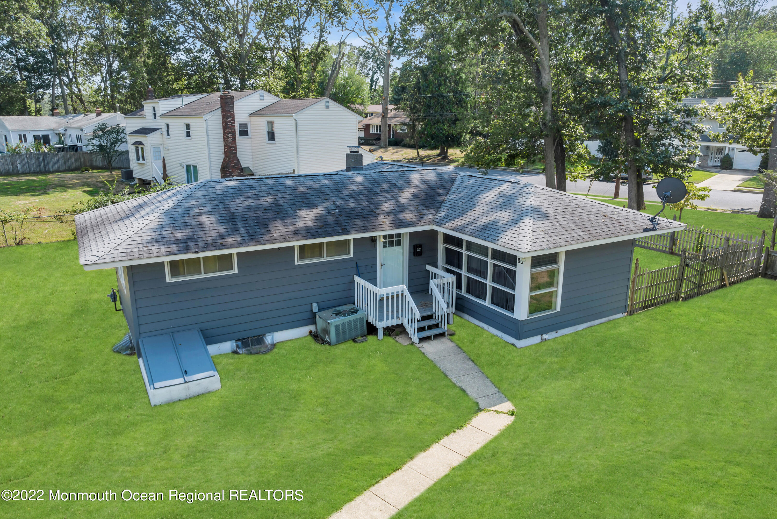 a aerial view of a house with a yard and a slide