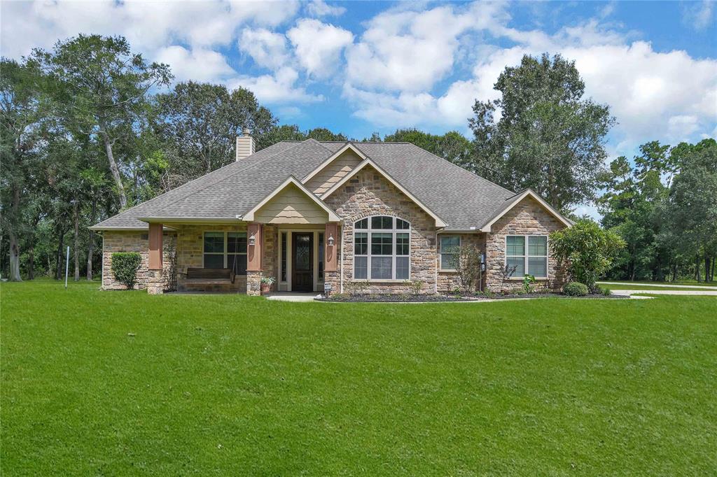 a view of a house with a big yard